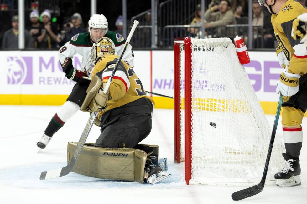 Coyotes right wing Clayton Keller (9) scores a goal on Golden Knights goaltender Logan Thompson ...