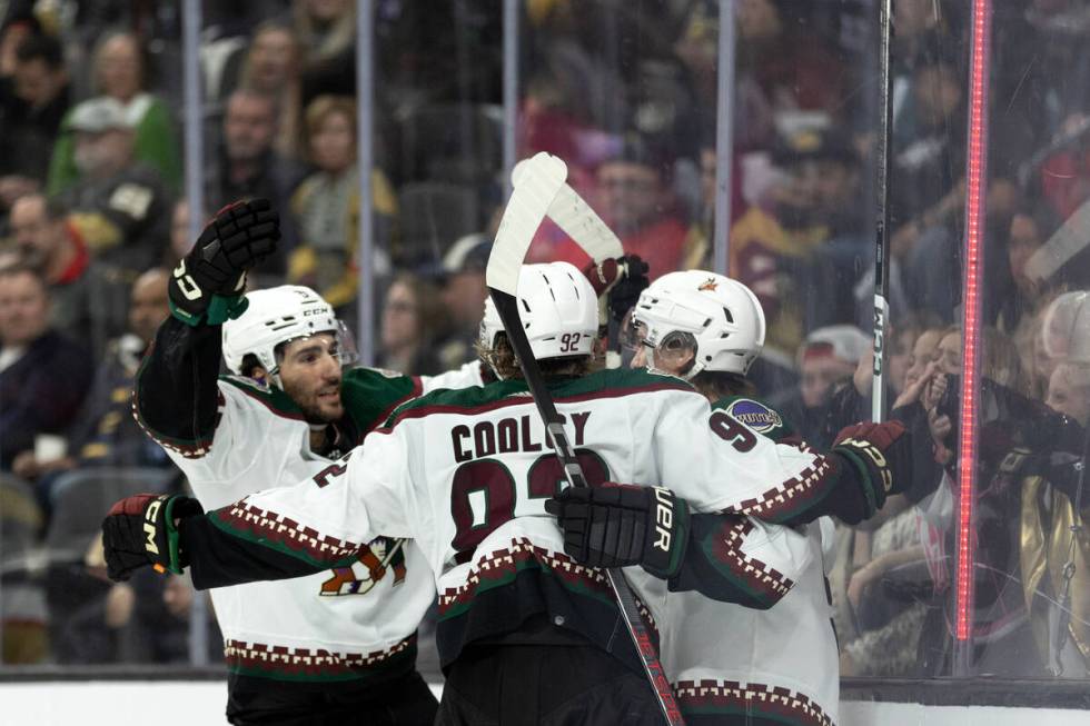 Coyotes center Nick Schmaltz, left, center Logan Cooley (92) and right wing Clayton Keller, rig ...