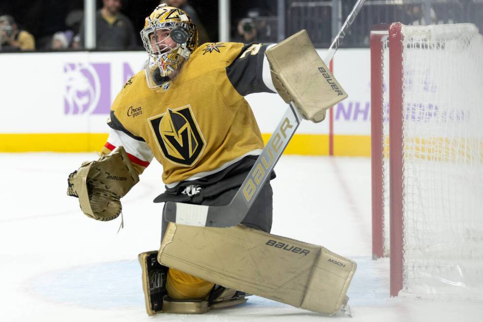 Golden Knights goaltender Logan Thompson (36) saves the puck during the third period of an NHL ...