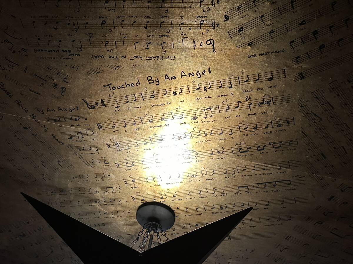 A look at sheet music from Damian Costa's grandfather Tony Costa is shown on the ceiling of The ...