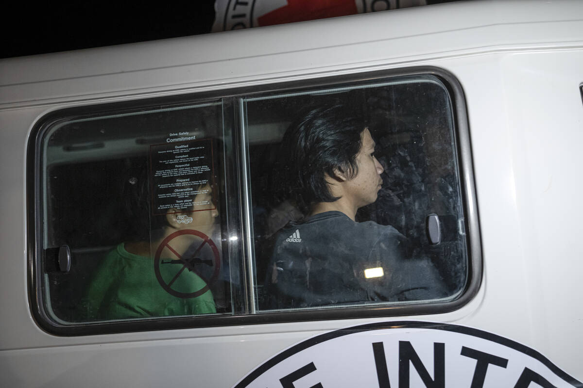 A Red Cross vehicle carrying Thai hostages drives by at the Gaza Strip crossing into Egypt in R ...