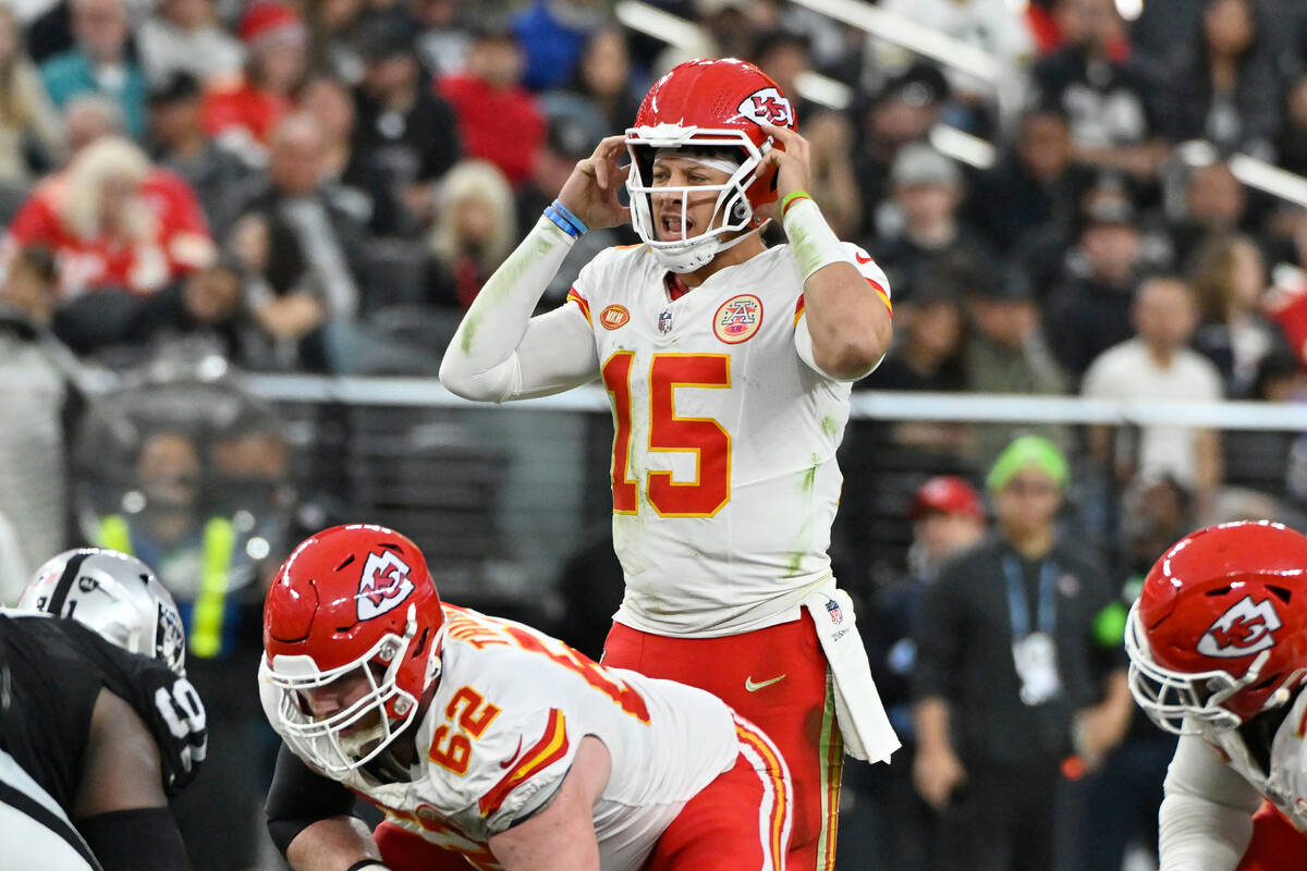 Kansas City Chiefs quarterback Patrick Mahomes (15) signals at the line of scrimmage during the ...