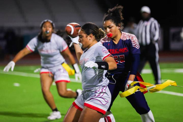 Coronado’s Samia Linton-Rivera (22) rips the flag off of Liberty’s Lolo Westerlun ...