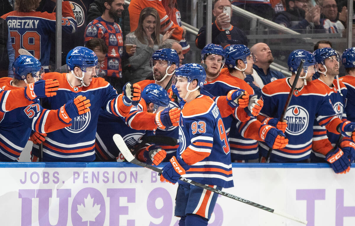 Edmonton Oilers' Ryan Nugent-Hopkins (93) celebrates a goal with his teammates against the Vega ...