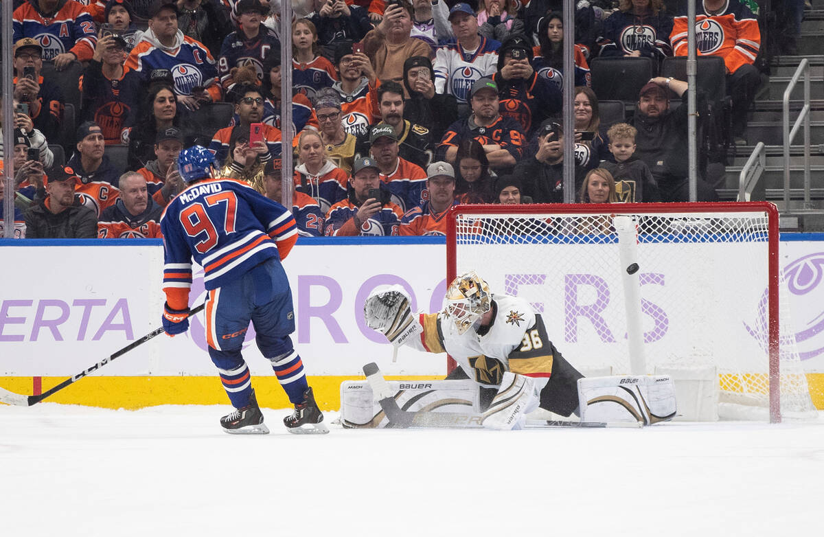 Vegas Golden Knights goalie Logan Thompson (36) is scored on by Edmonton Oilers' Connor McDavid ...