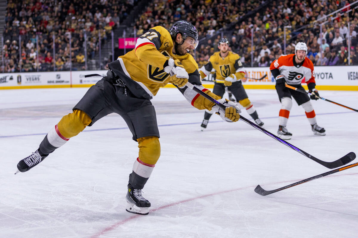 Golden Knights defenseman Shea Theodore (27) shoots on goal against the Philadelphia Flyers dur ...