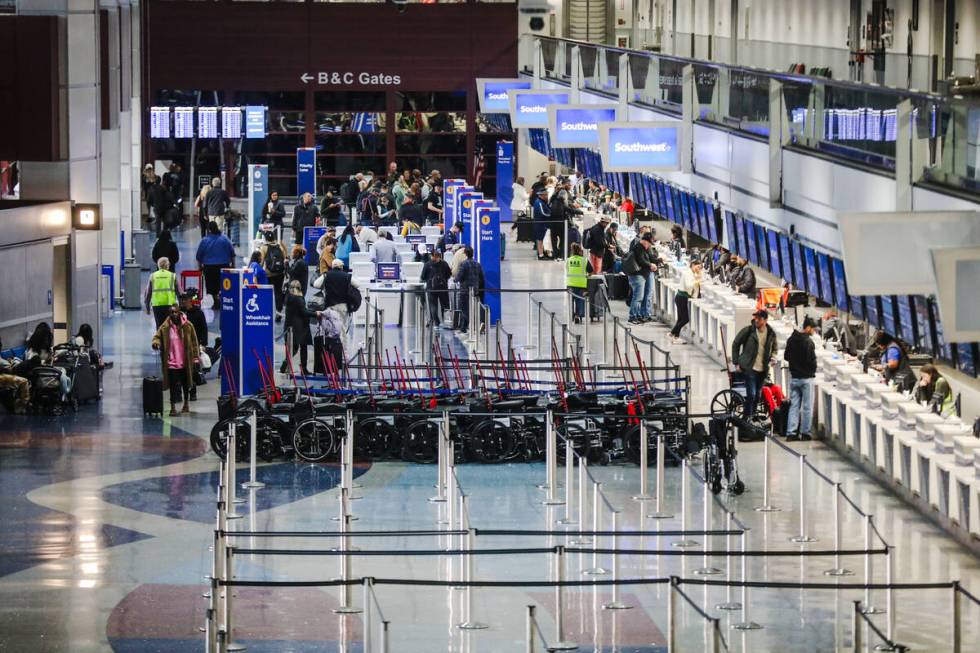 Guests at the ticket counters at Harry Reid International Airport in Las Vegas, Sunday, Nov. 19 ...