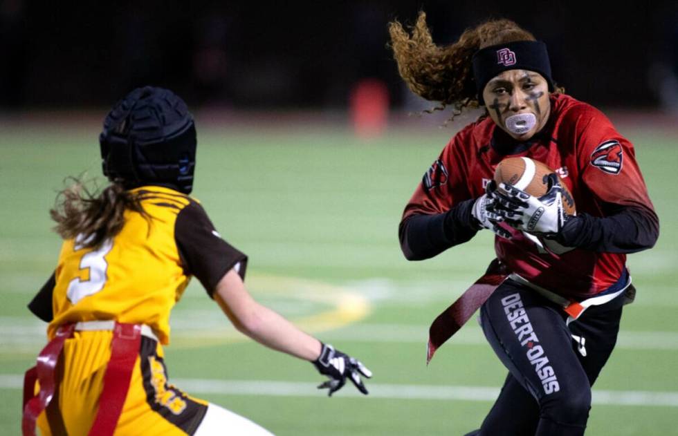 Desert Oasis wide receiver Brooklin Hill (10) runs the ball against Bonanza’s Reagan Coupe (3 ...