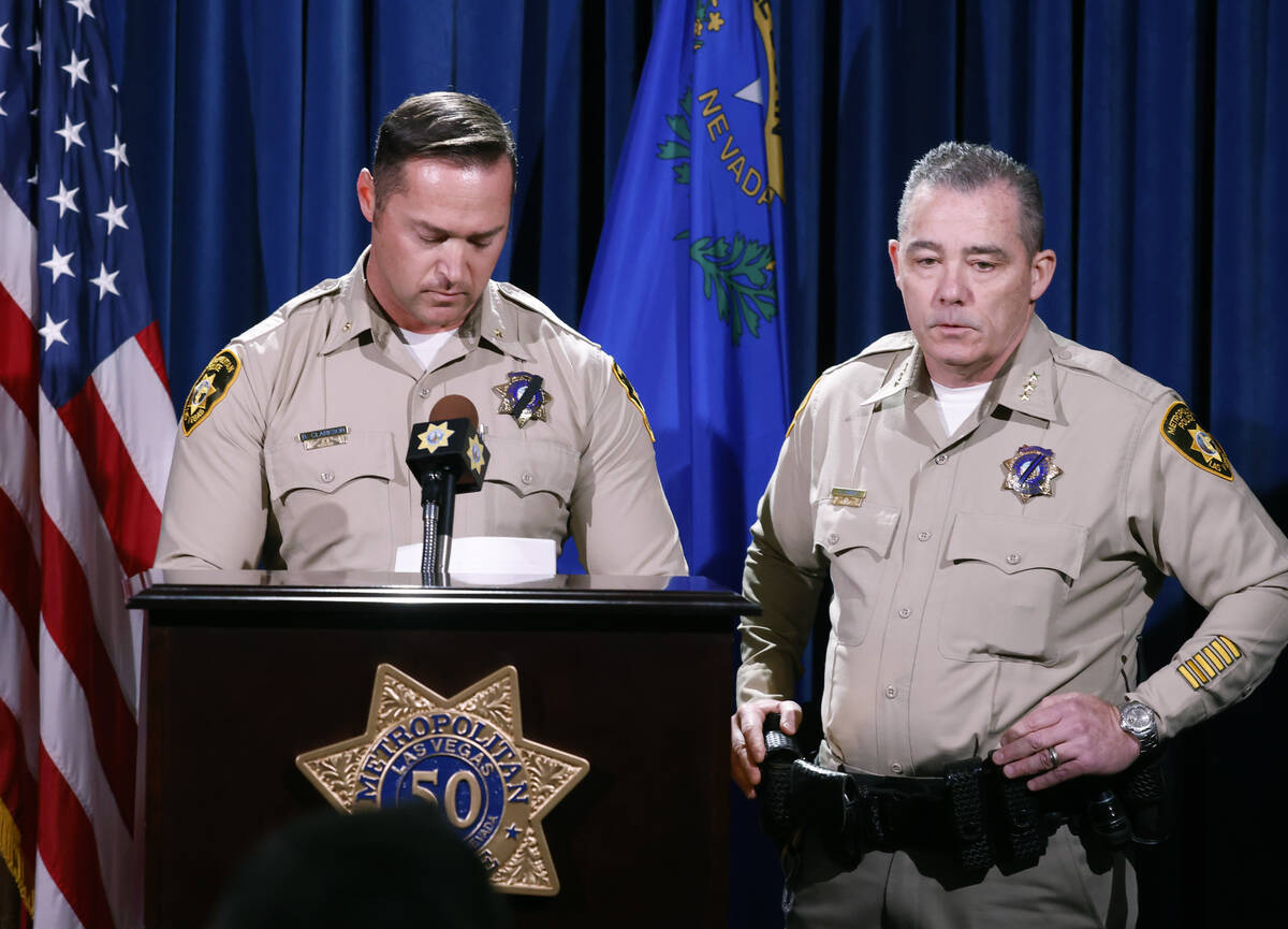 Undersheriff Andrew Walsh, right, speaks about two Nevada State Troopers that were killed on I- ...