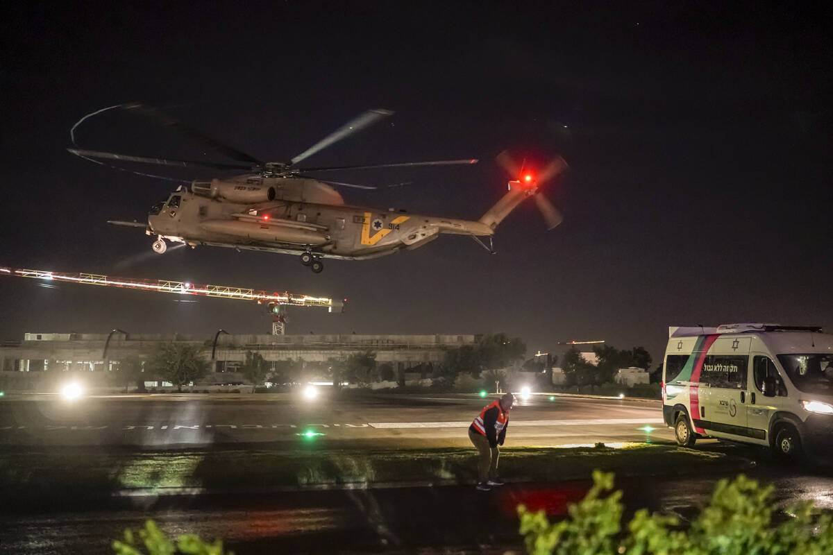 A helicopter carrying Israeli hostages released by Hamas lands at the Sheba Medical Center in R ...