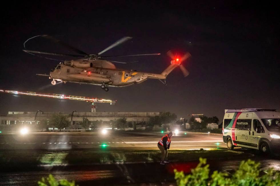 A helicopter carrying Israeli hostages released by Hamas lands at the Sheba Medical Center in R ...