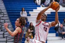 Coronado's Tee Bartlett (13) grabs a rebound as Arbor View's Maximus Romero (1) arrives late du ...