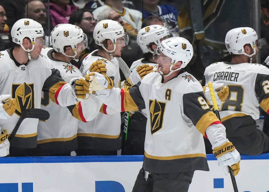 Vegas Golden Knights' Jack Eichel (9) is congratulated for a goal against the Vancouver Canucks ...