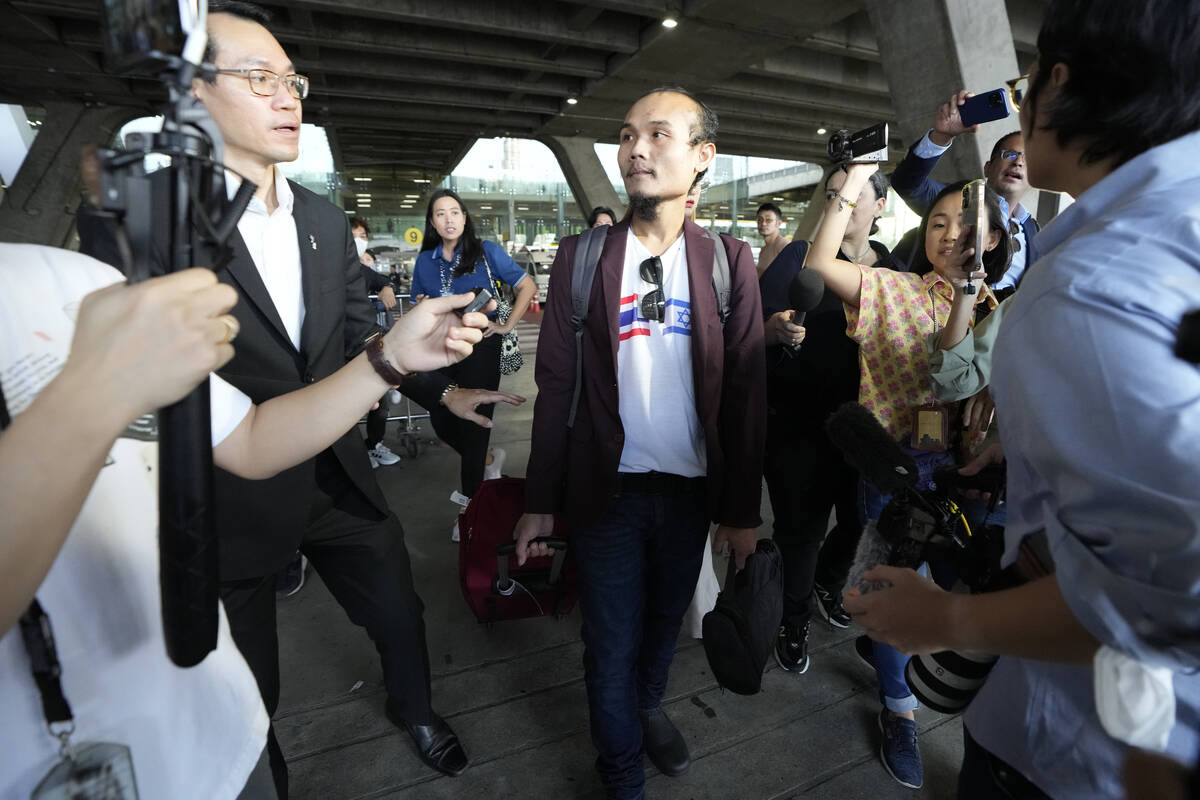 Pornsawan Pinakalo, a Thai hostages who was freed from Hamas, leaves after arriving at Suvarnab ...