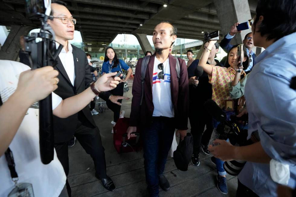 Pornsawan Pinakalo, a Thai hostages who was freed from Hamas, leaves after arriving at Suvarnab ...