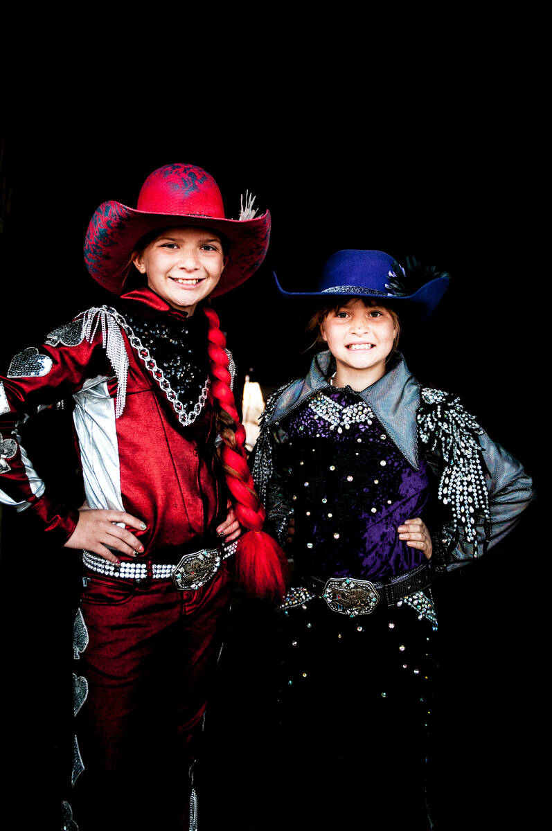 Rhea, left, and Rori Fenner pose for a photo in their rodeo garb. The Fenner family practices b ...