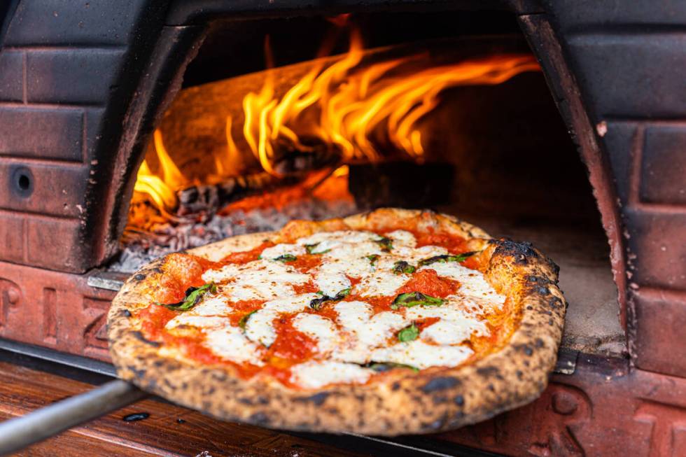 Yukon Pizza at the eastern edge of downtown Las Vegas is celebrating one year in its bricks-and ...