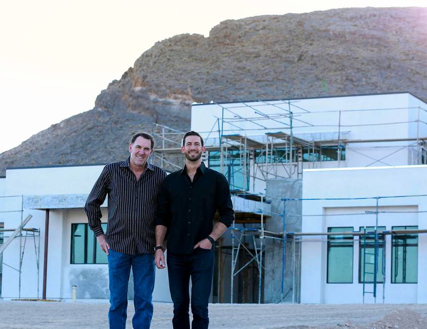 Father-and-son team Ken and Kris Templeton of Templeton Development Corp. stand in front of on ...