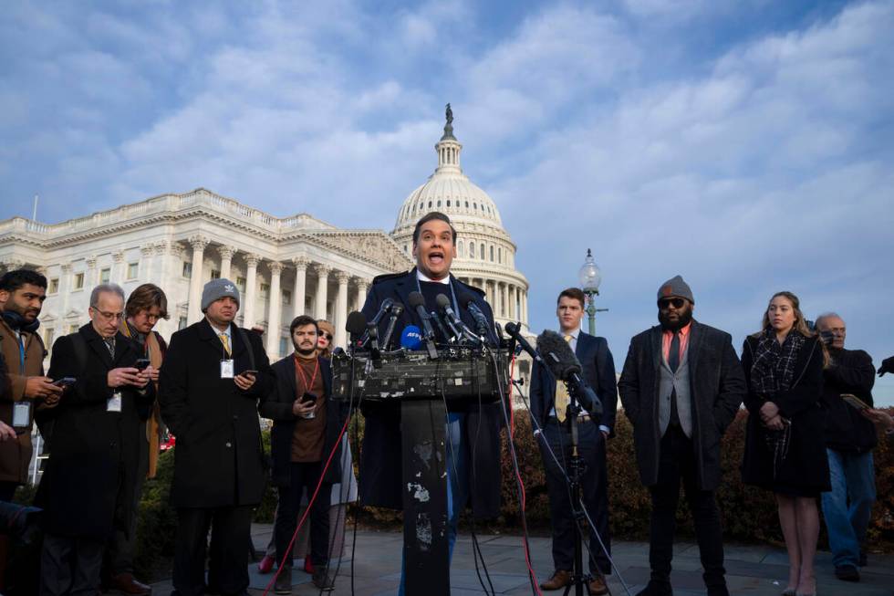 Rep. George Santos, R-N.Y., faces reporters at the Capitol in Washington, early Thursday, Nov. ...