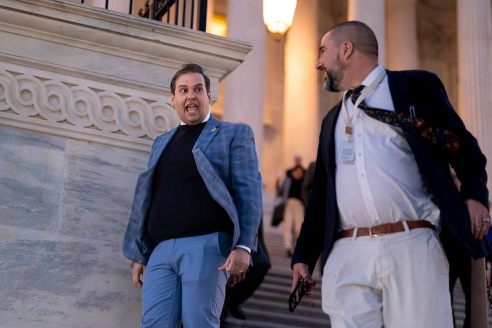 Rep. George Santos, R-N.Y., departs the Capitol in Washington, Thursday evening, Nov. 30, 2023. ...