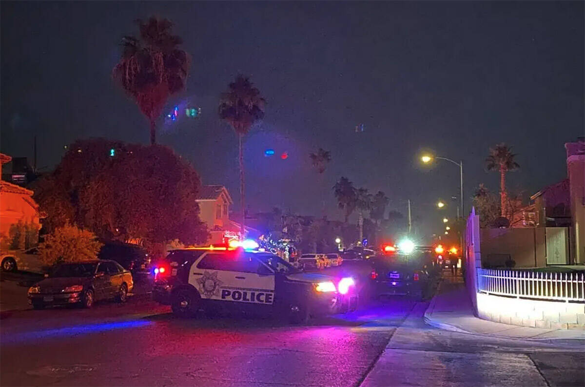 Las Vegas police at the scene of an officer-involved shooting near East Sahara Avenue and Sloan ...