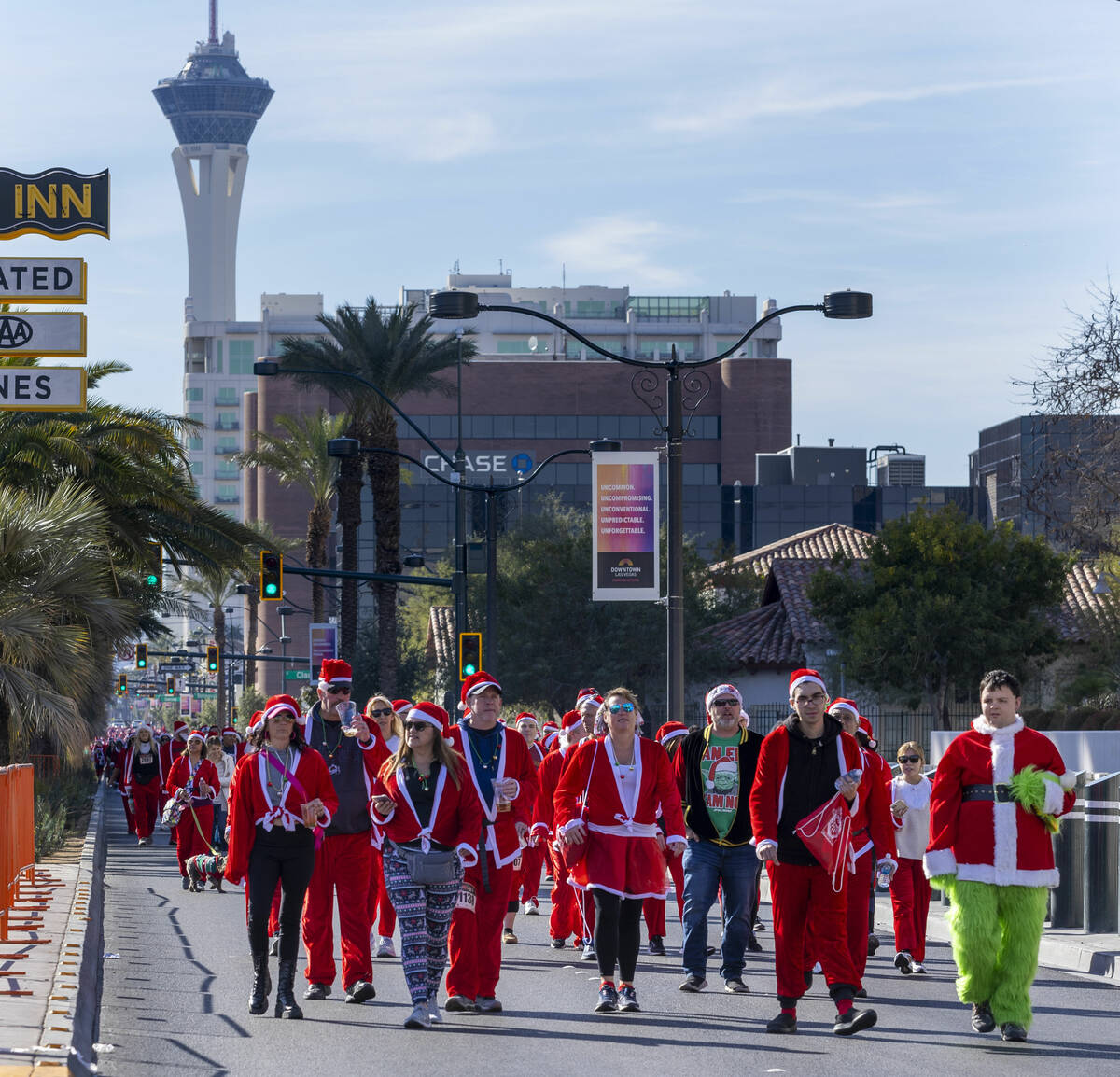 Participants in the 1-mile jaunt move up Las Vegas Boulevard heading to the finish line during ...