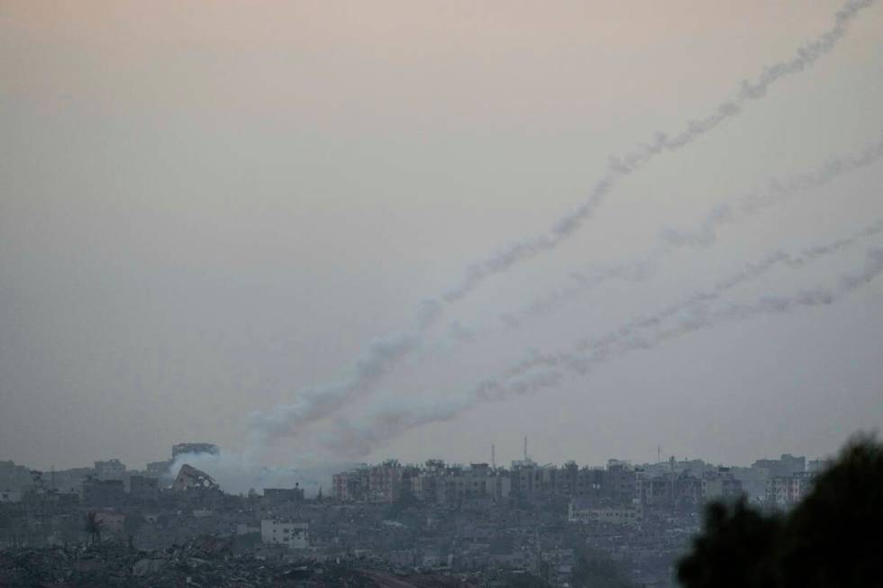 Trails of rockets fired towards Israel from the Gaza Strip, as seen from southern Israel, Satur ...