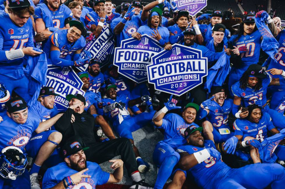 Boise State players celebrate winning the Mountain West championship game at Allegiant Stadium ...