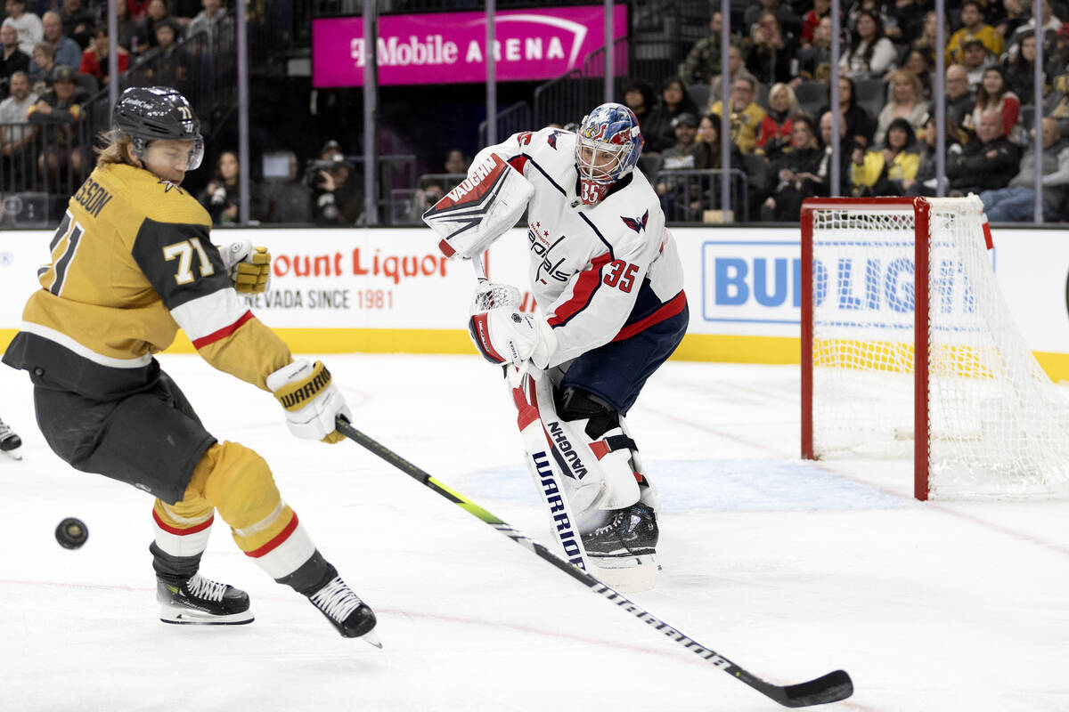 Capitals goaltender Darcy Kuemper (35) saves the puck against Golden Knights center William Kar ...