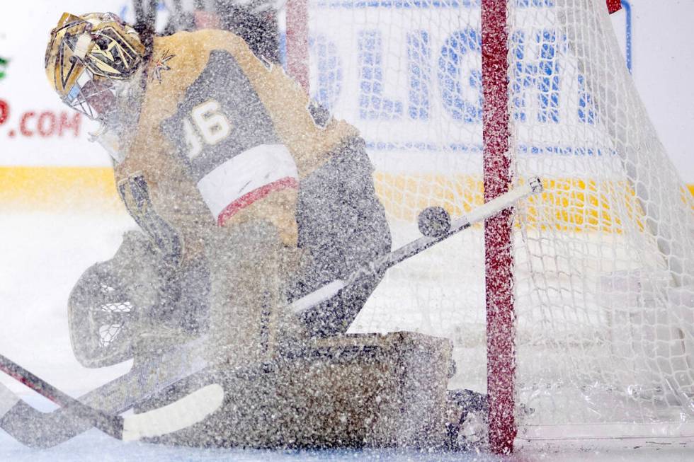 Golden Knights goaltender Logan Thompson (36) saves the puck during the second period of an NHL ...