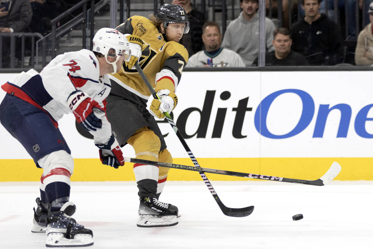 Golden Knights center William Karlsson (71) attempts a goal while Capitals defenseman John Carl ...