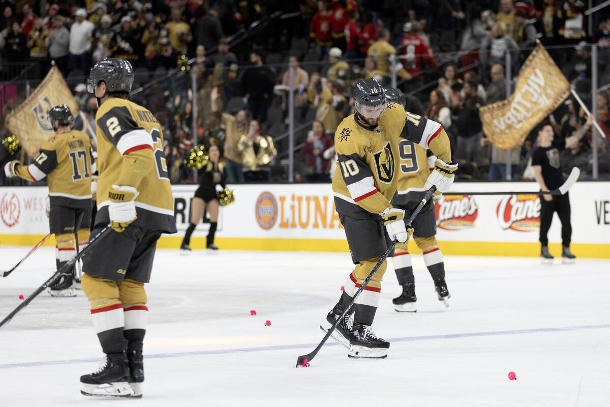 Golden Knights center Nicolas Roy (10) dangles plastic flamingos after his team won an NHL hock ...