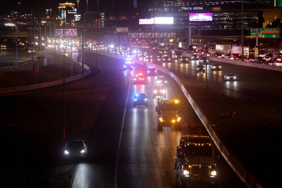 Tow truck operators, Nevada Highway Patrol and Capitol Police drive in a memorial procession on ...