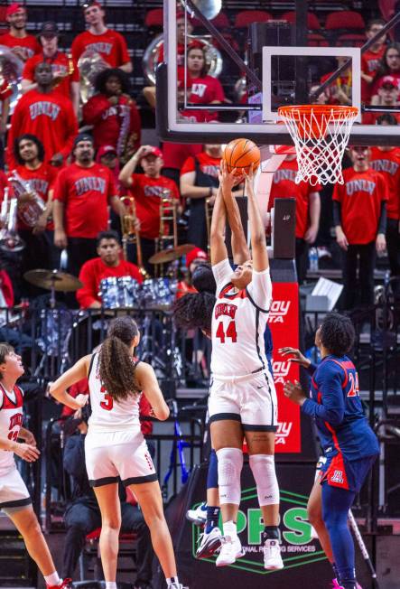 UNLV Lady Rebels forward Alyssa Brown (44) grabs a rebound as Arizona Wildcats guard Salimatou ...