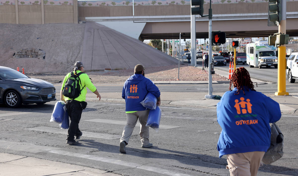 HELP of Southern Nevada workers, from left, Chris Engel, Richard Lopez and Yolanda Bogan perfor ...