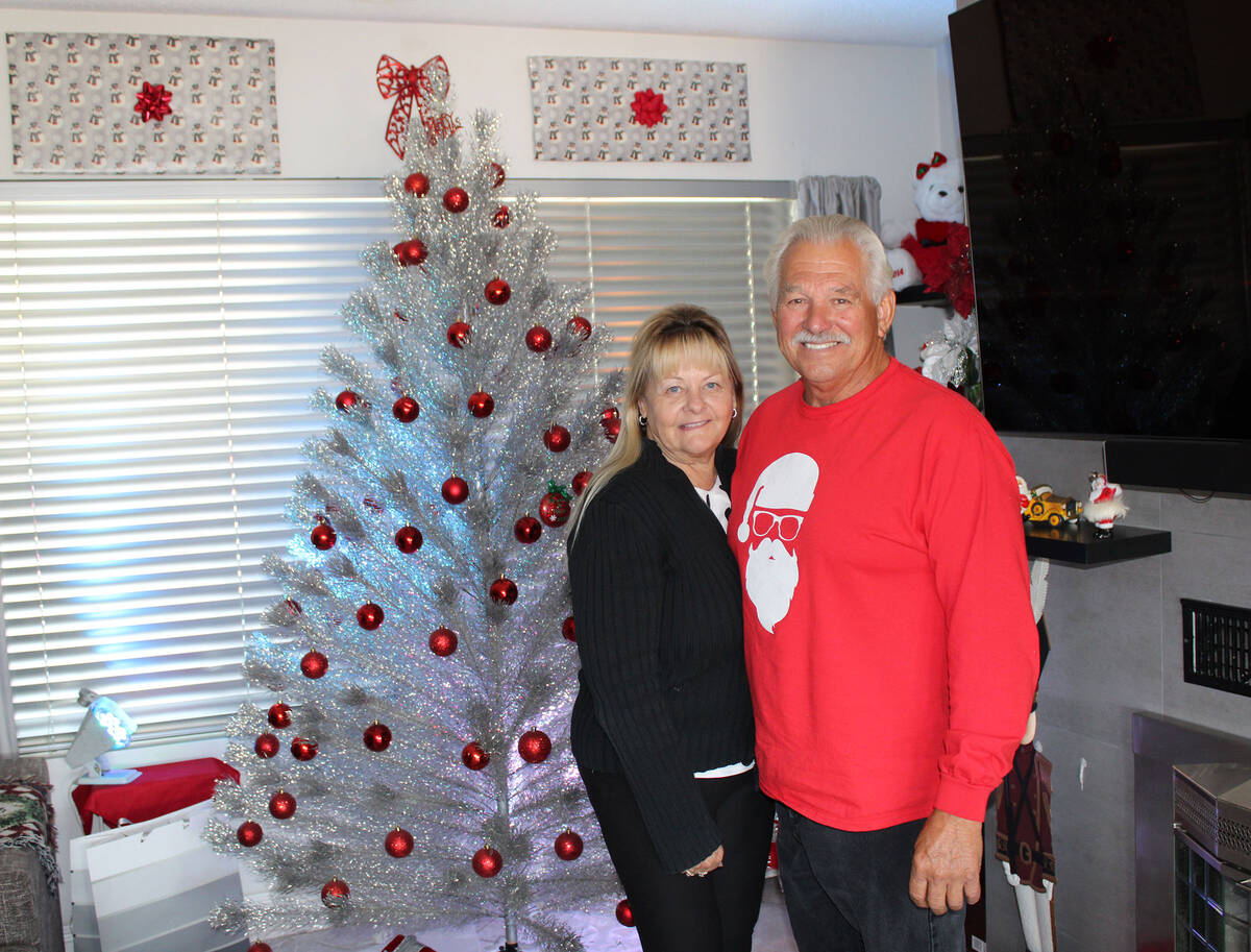 Dyanah Musgrave and Dale Ryan stand in front of an artificial tree her parents bought in 1959. ...