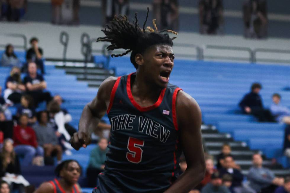 Arbor View’s Pharaoh Compton (5) celebrates making a dunk during a basketball game betwe ...