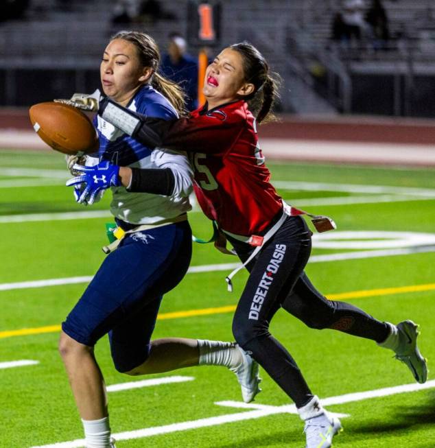 Shadow Ridge receiver Aaliyah Jaime (21) has a pass slapped away by Desert Oasis defender Bria ...