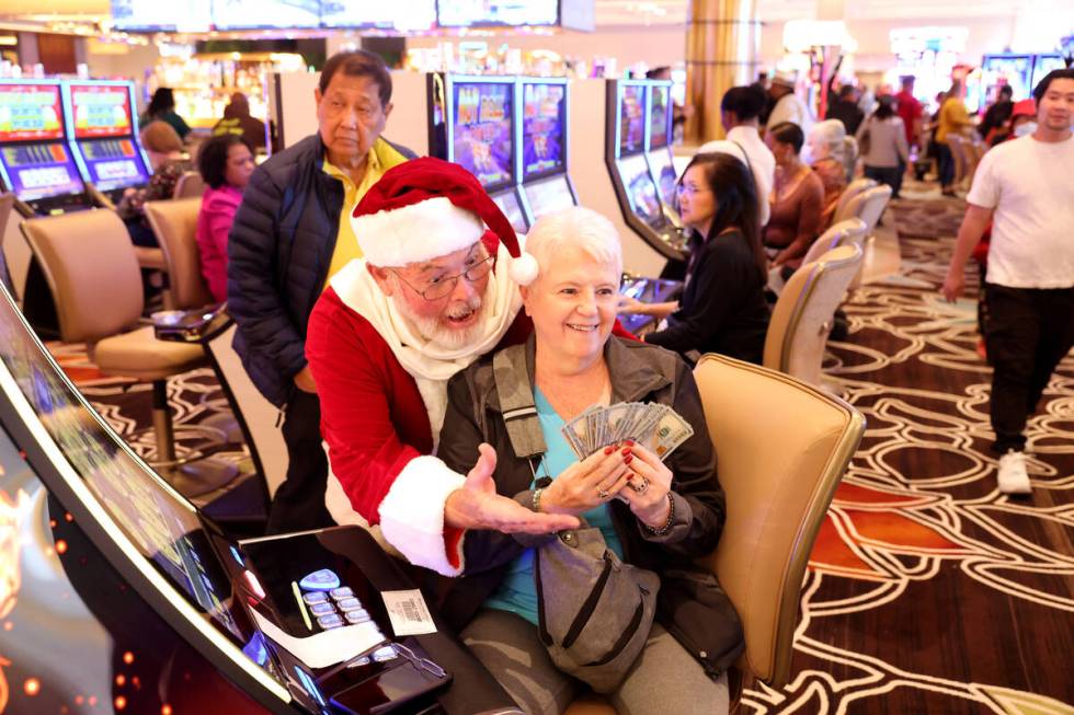 John Moss as Santa Clause reacts to a jackpot won by Marie Nankervis during the opening of Dura ...