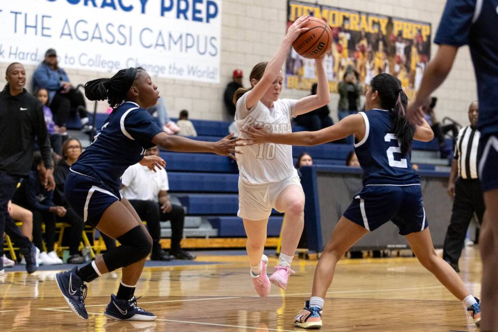 Democracy Prep’s Madison Smith (10) powers through Shadow Ridge’s Zh’mya M ...