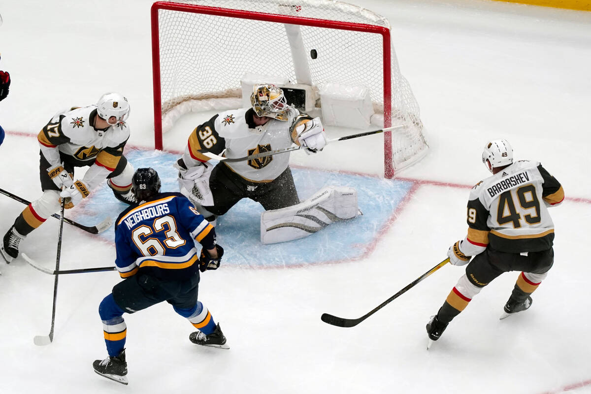 St. Louis Blues' Jake Neighbours (63) scores past Vegas Golden Knights goaltender Logan Thompso ...