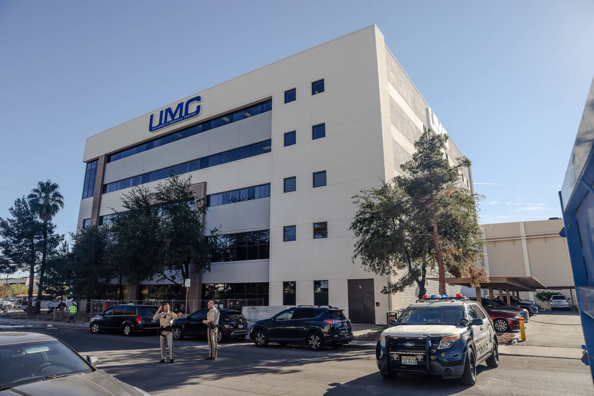 Police gather outside UMC following an active shooter at UNLV in Las Vegas, Wednesday, Dec. 6, ...