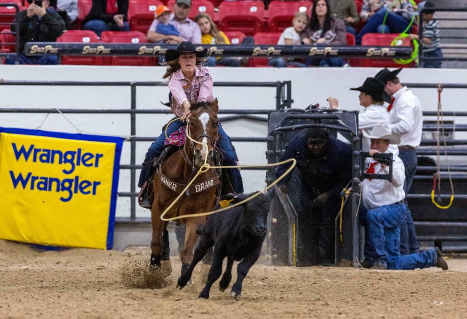 Rickie Fanning of Spearfish S.D., looks to rope a calf during the NFR breakaway roping challeng ...