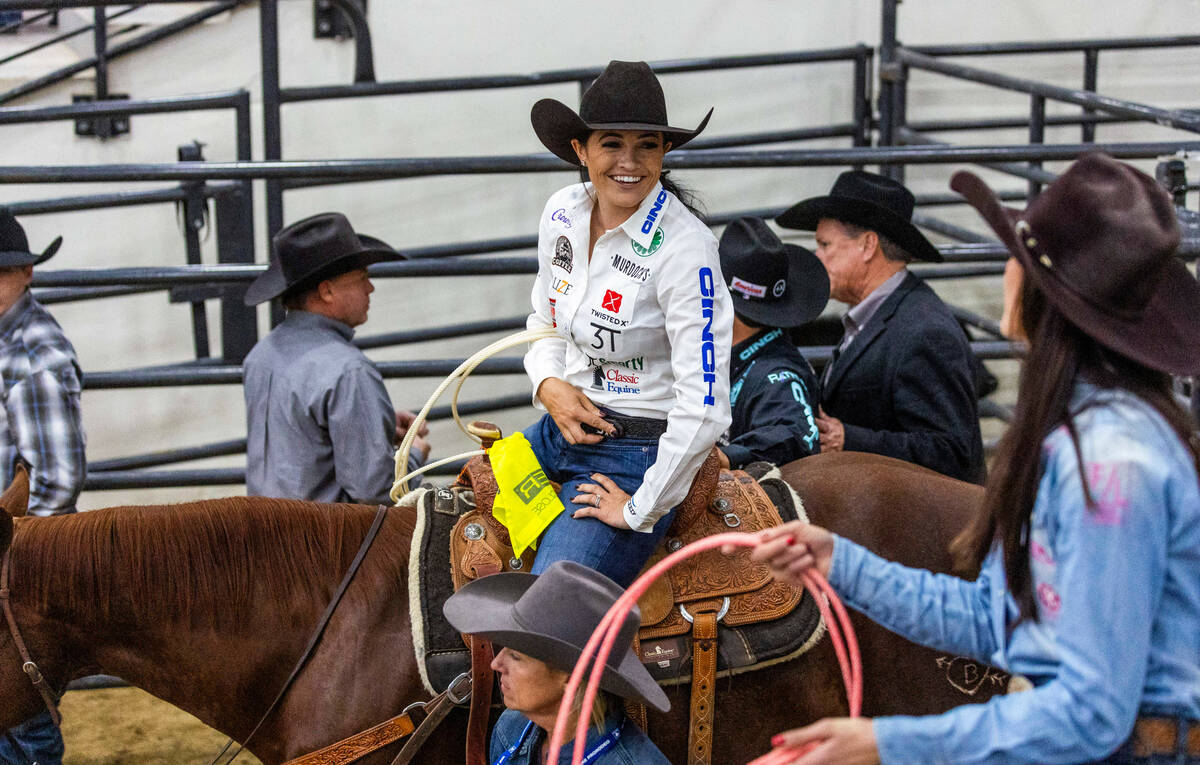 Shelby Boisjoli-Meged of Stephenville, Texas, chats with Joey Williams of Volborg, MT., during ...