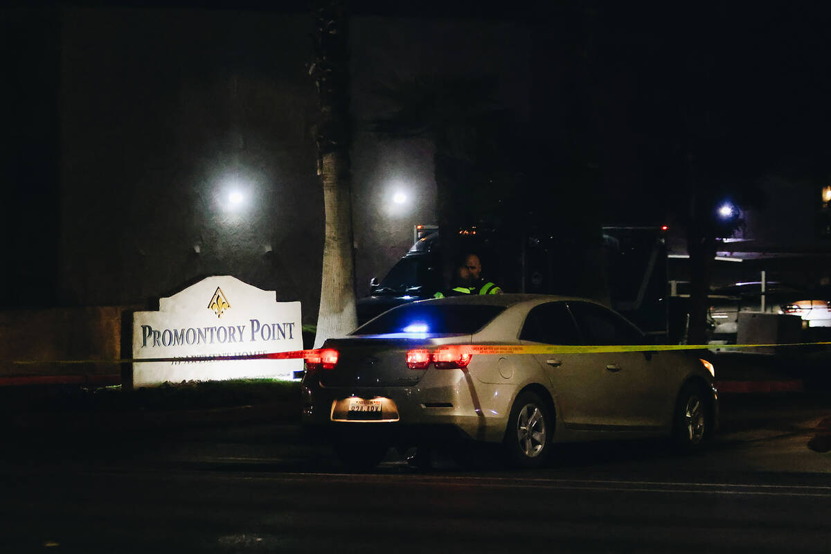 Police block off the entrance to the apartment complex of a potential suspect in the shooting a ...