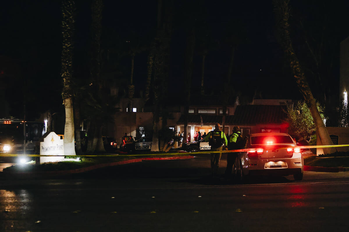 Police block off the entrance to the apartment complex of a potential suspect in the shooting a ...