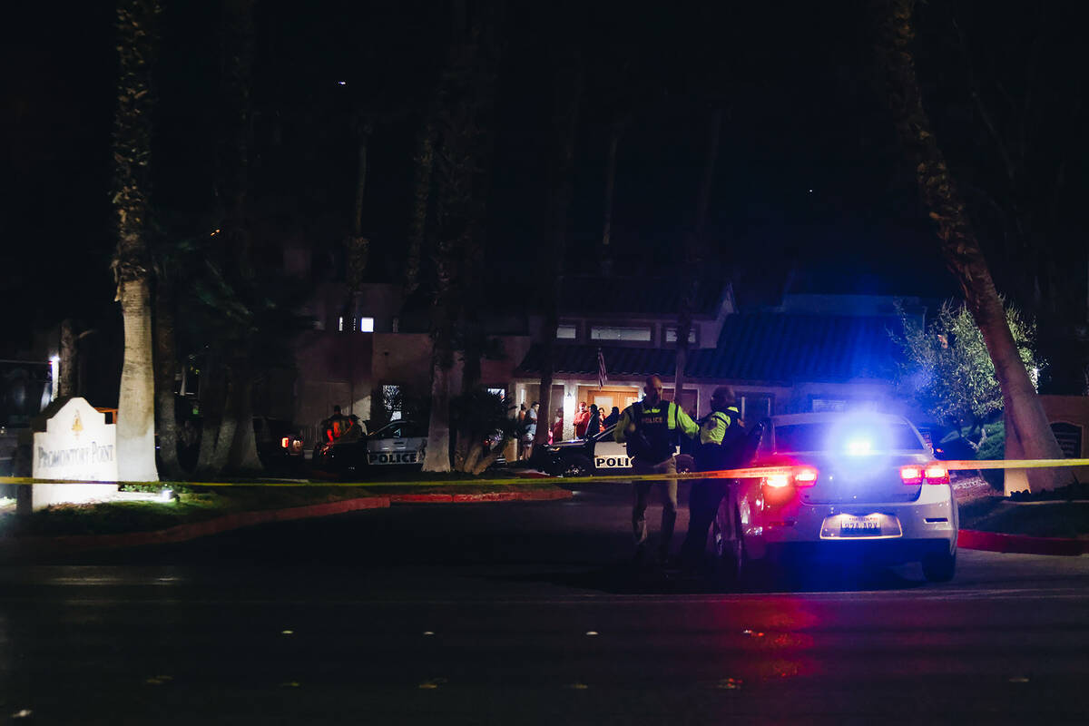 Police block off the entrance to the apartment complex of a potential suspect in the shooting a ...