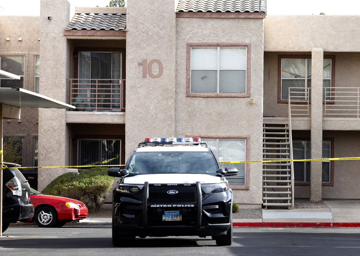 LVMPD vehicle is parked outside the residence of the man suspected in the deadly UNLV shooting, ...
