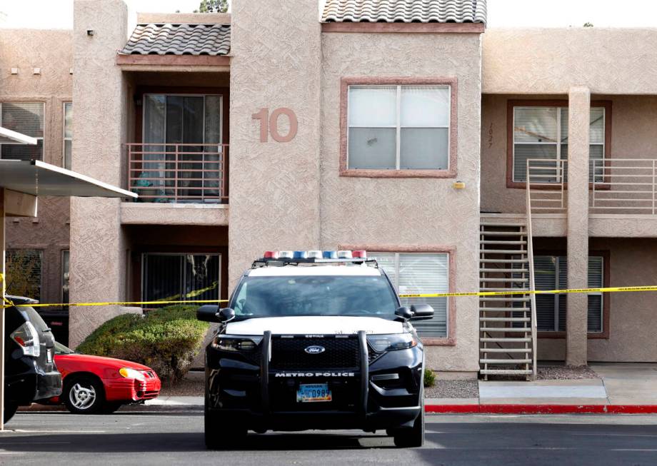 LVMPD vehicle is parked outside the residence of the man suspected in the deadly UNLV shooting, ...