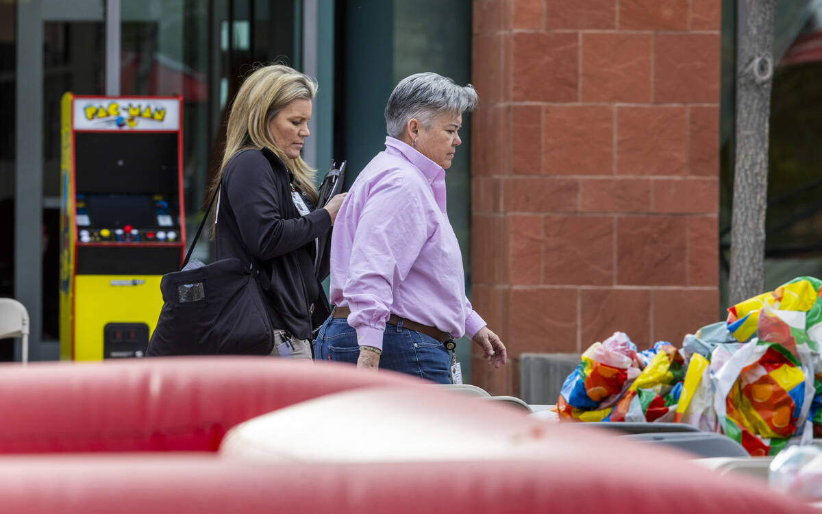 Clark County Coroner personnel walk past the Student Union following the shooting yesterday on ...